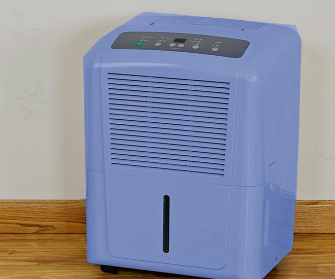 Dehumidifier running in a damp room to reduce humidity and prevent mold growth
